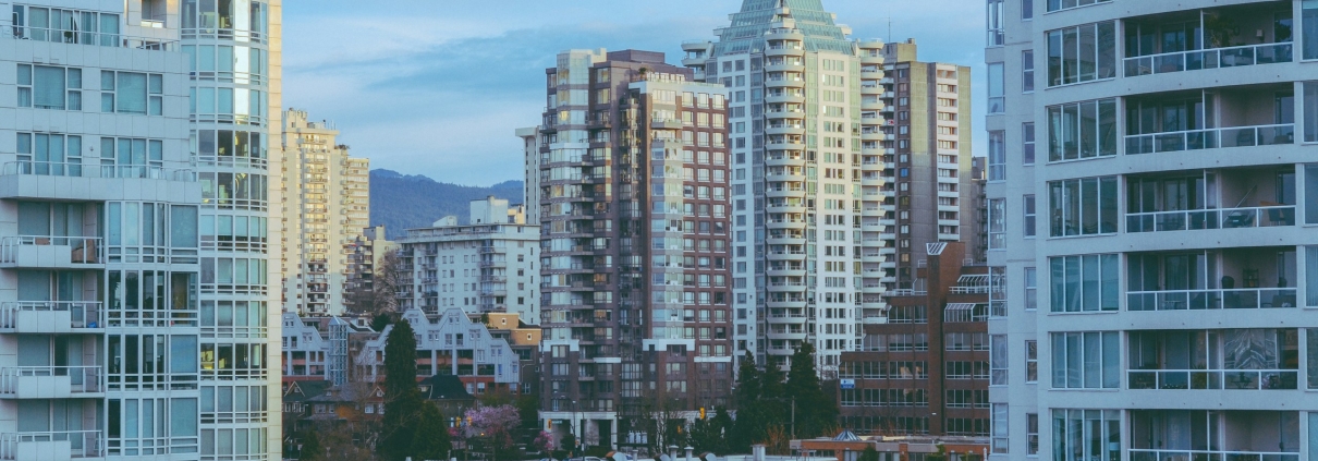 Tall residential towers rising against an overcast sky.